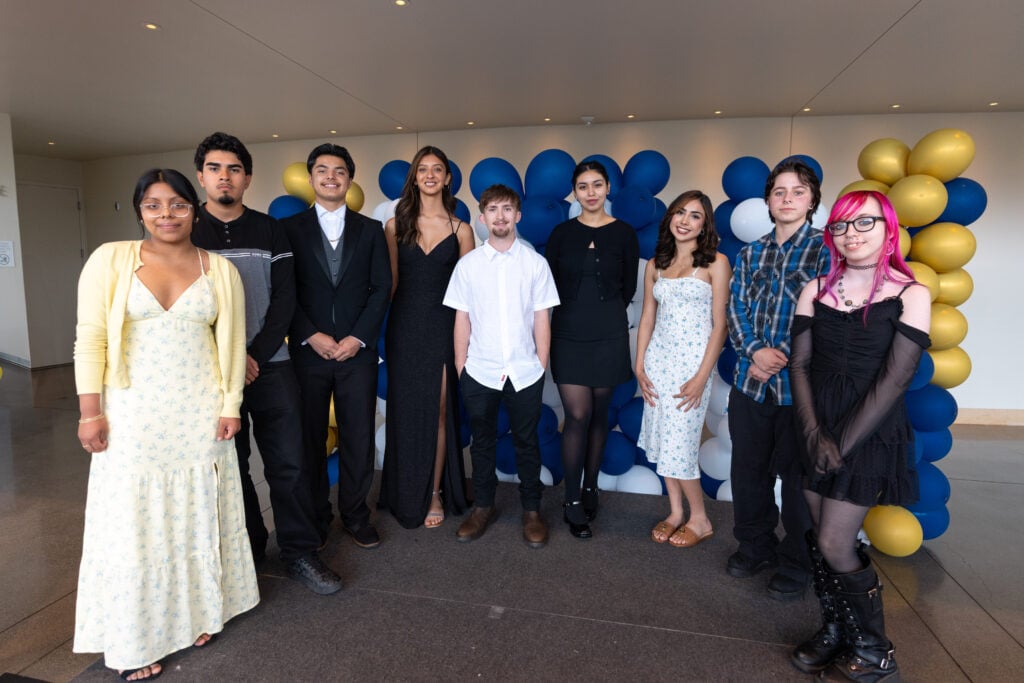 Group of young adults dressed for an event.