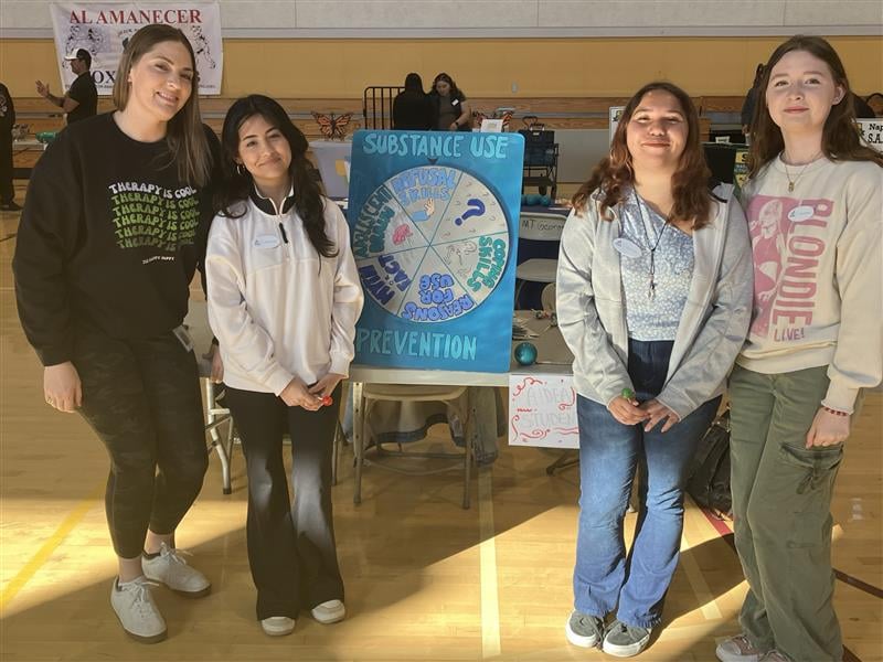 Students promoting substance use prevention awareness event.